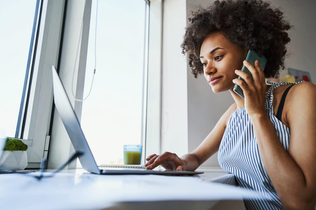 Female freelancer concentrated on writing an email How to Change Outlook Views